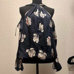 Unique Blue blouse with floral print.